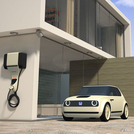 Tříčtvrtinový pohled zepředu na koncept Honda Urban EV s nabíjecí stanicí